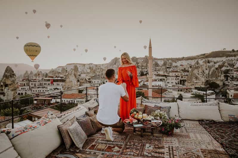 Marriage Proposal Surprise & Engagement in Cappadocia - Love Valley proposal setup: candles, rugs, and a photo corner
